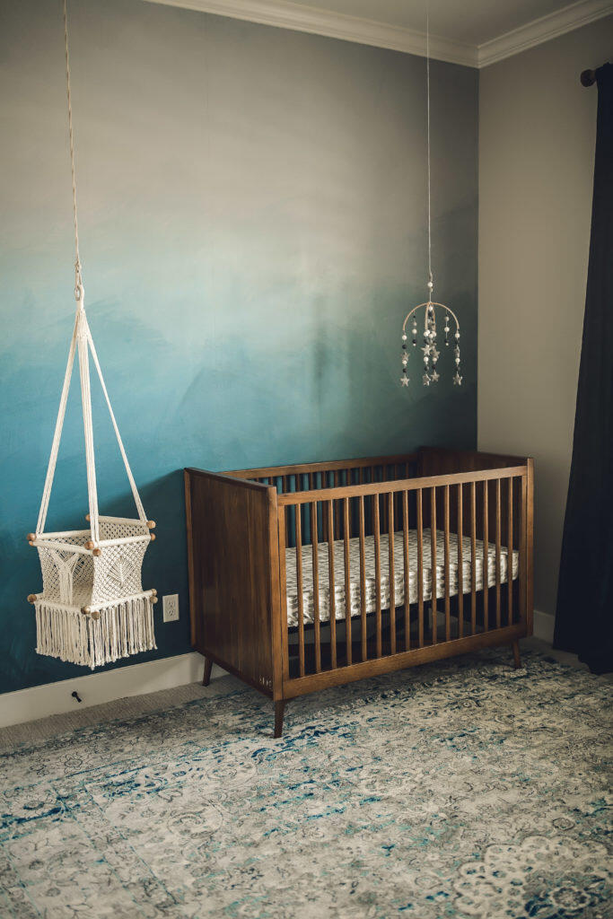 blue ombre nursery wall with felt mobile and macrame swing